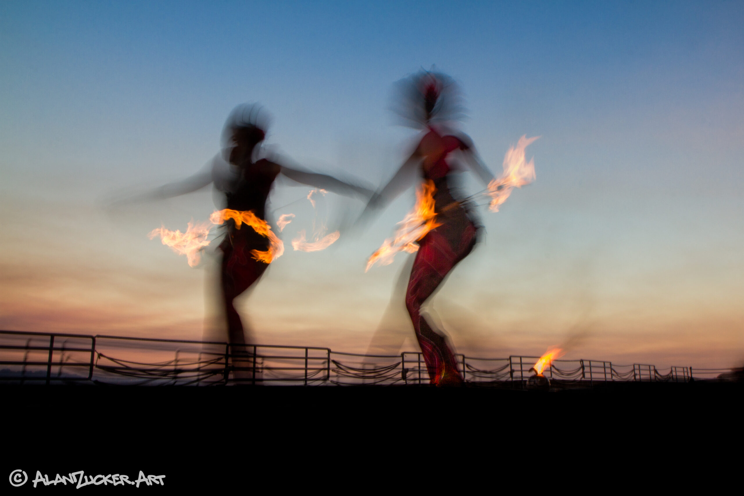 Fire dancers in motion.